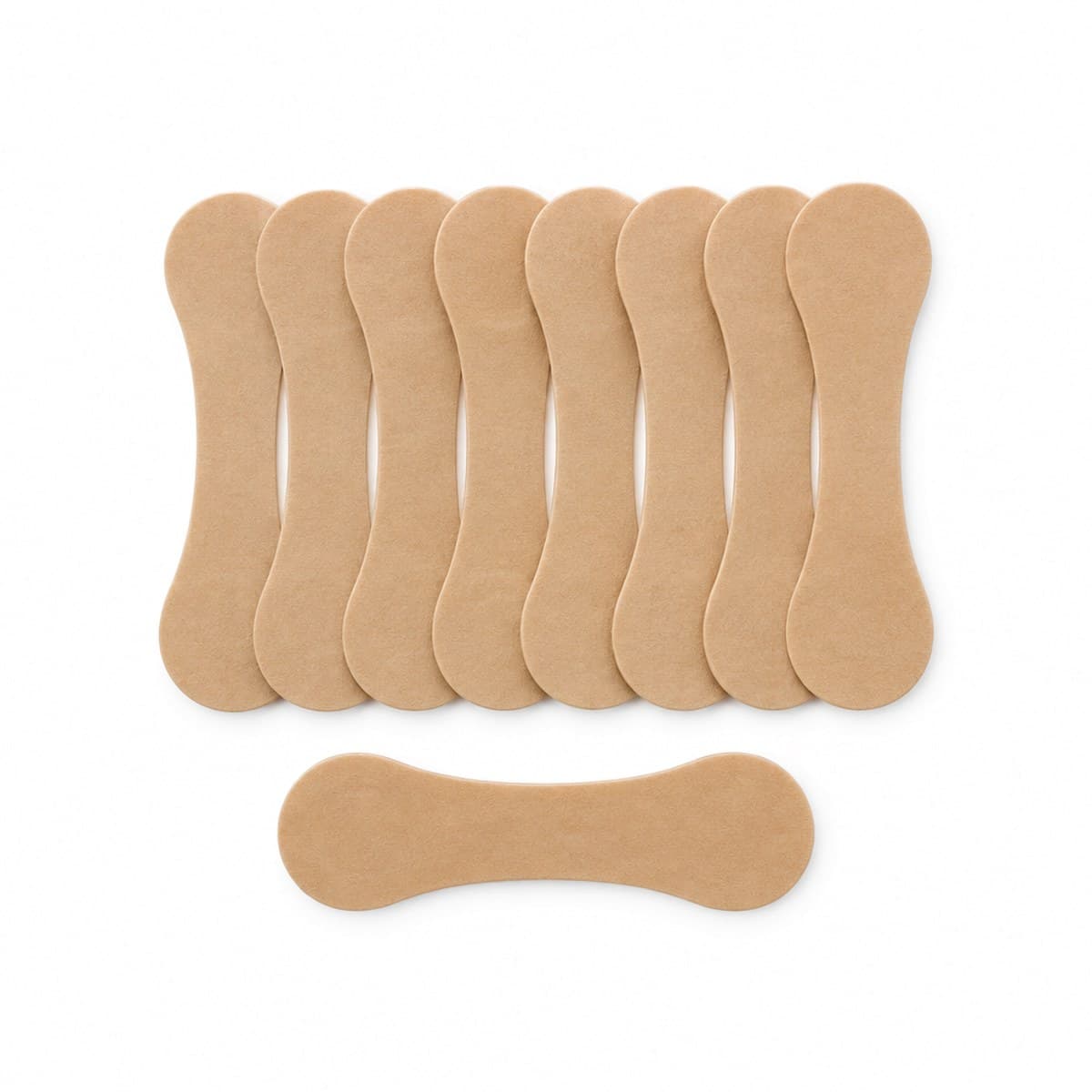 Nine tan fabric nasal strips on white: eight side by side in a row, and one lying in front